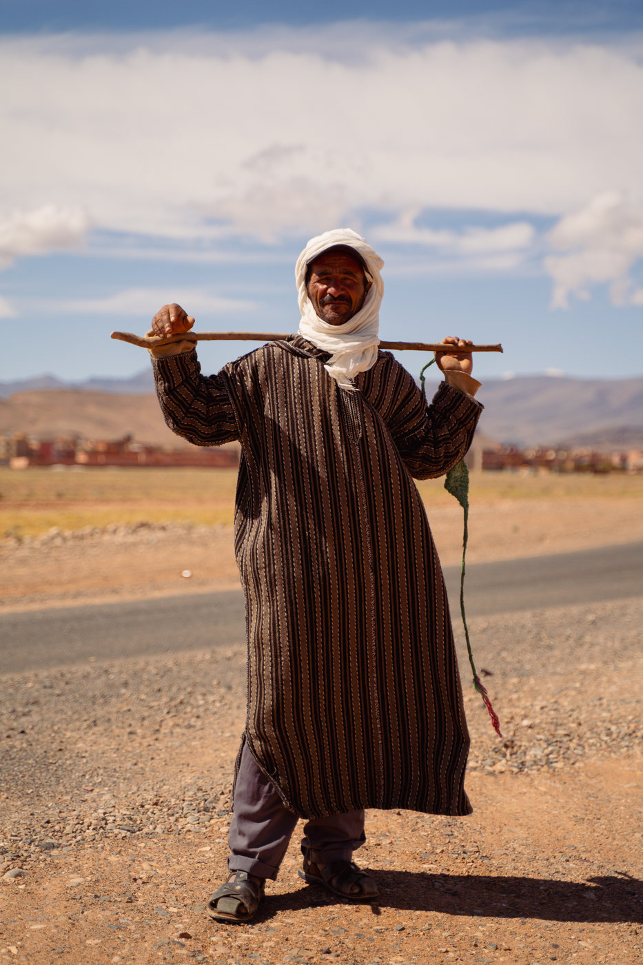 A man with a walking stick