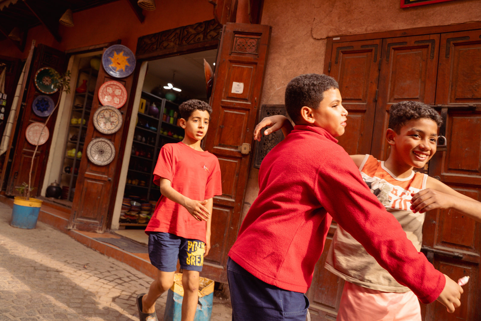 Kids hugging in a street